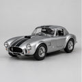 Illustrative silver die-cast racing coupe